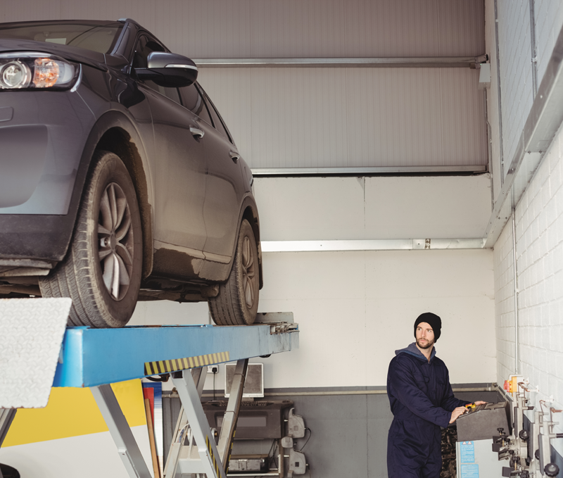 Vehicle positioned in an MOT testing bay