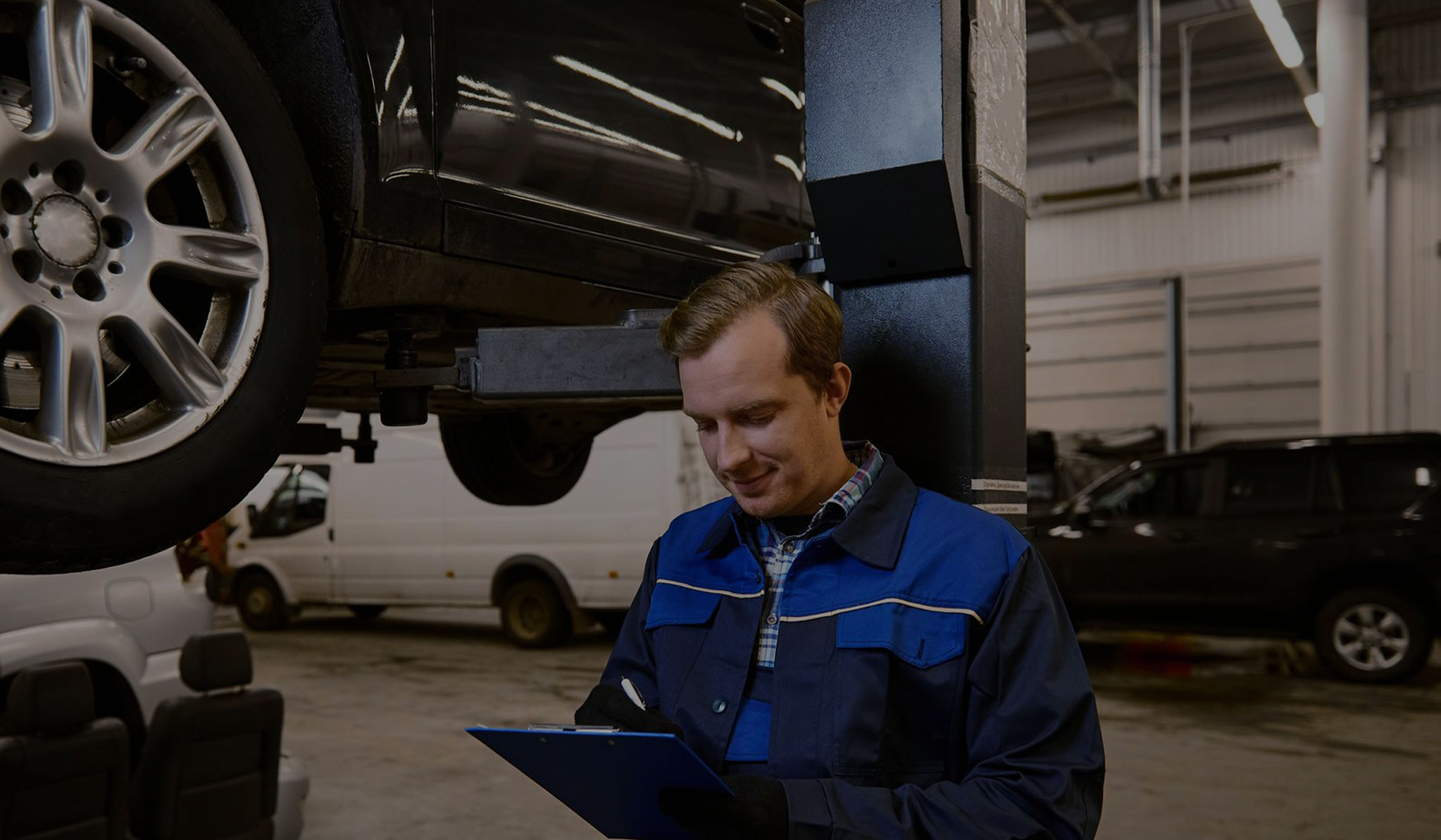 Technician carrying out an MOT inspection