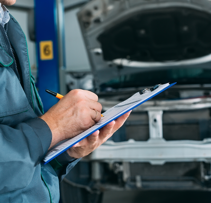 Technician recording inspection results